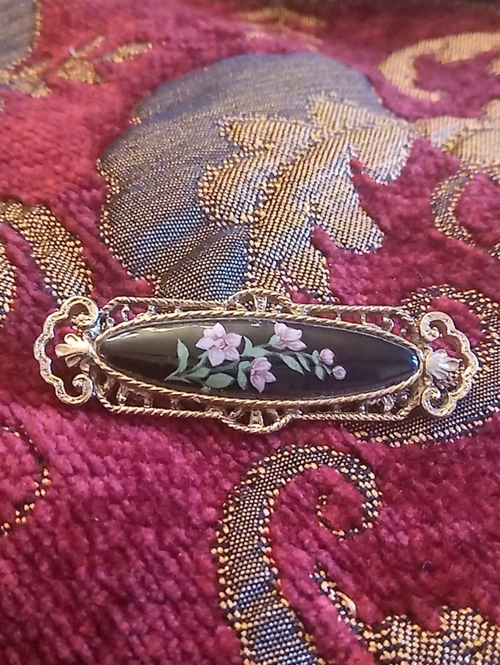 Vintage Black Enamel Brooch with Pink Floral Motif and Gold Frame